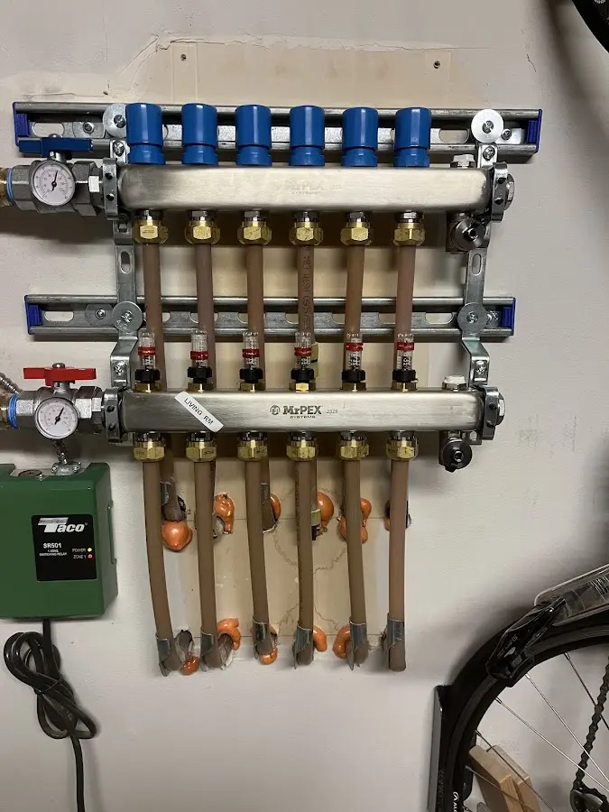 Plumber performing Water Heater Repair at a residential property in Hayden